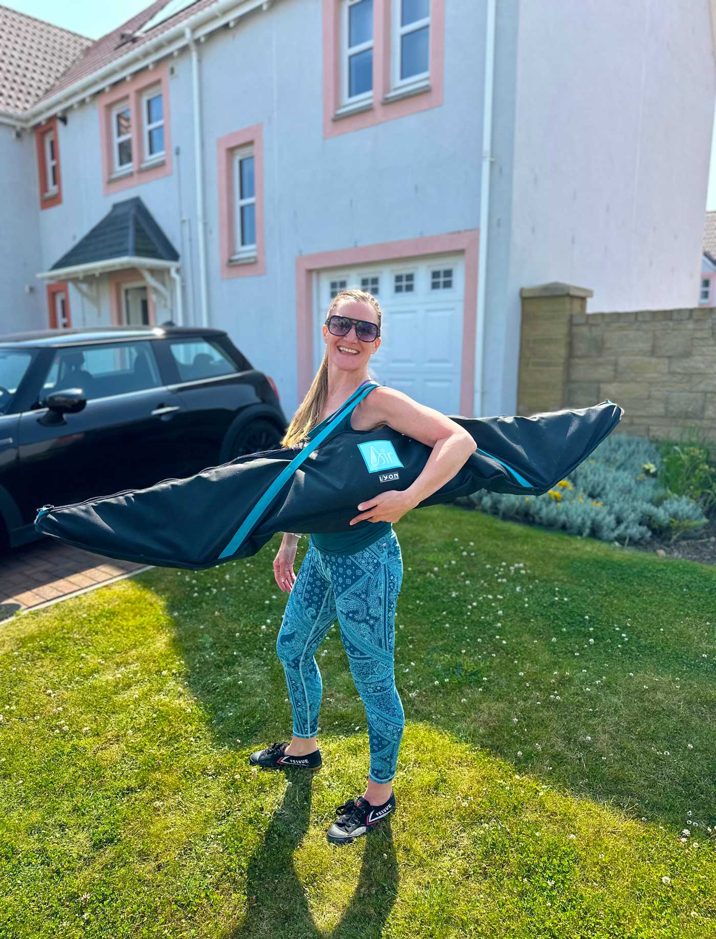 Debbie holding the bespoke air-frame bag in her garden