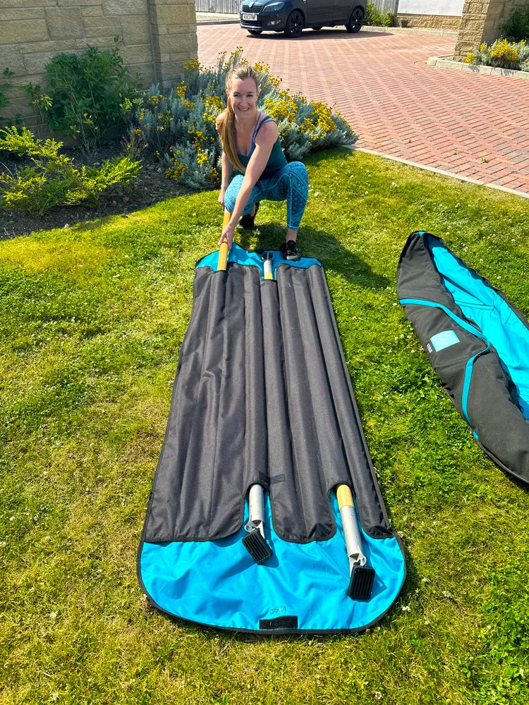 Debbie slides the wooden legs of the Aif Frame back into its besoke bag.